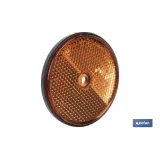 CATADIÓPTRICO REDONDO ÁMBAR Ø60 MM CON AGUJERO SIN TORNILLO