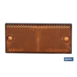 CATADIÓPTRICO RECTANGULAR ÁMBAR 106 X 50 MM CON AGUJERO SIN TORNILLO CON ADHESIVO